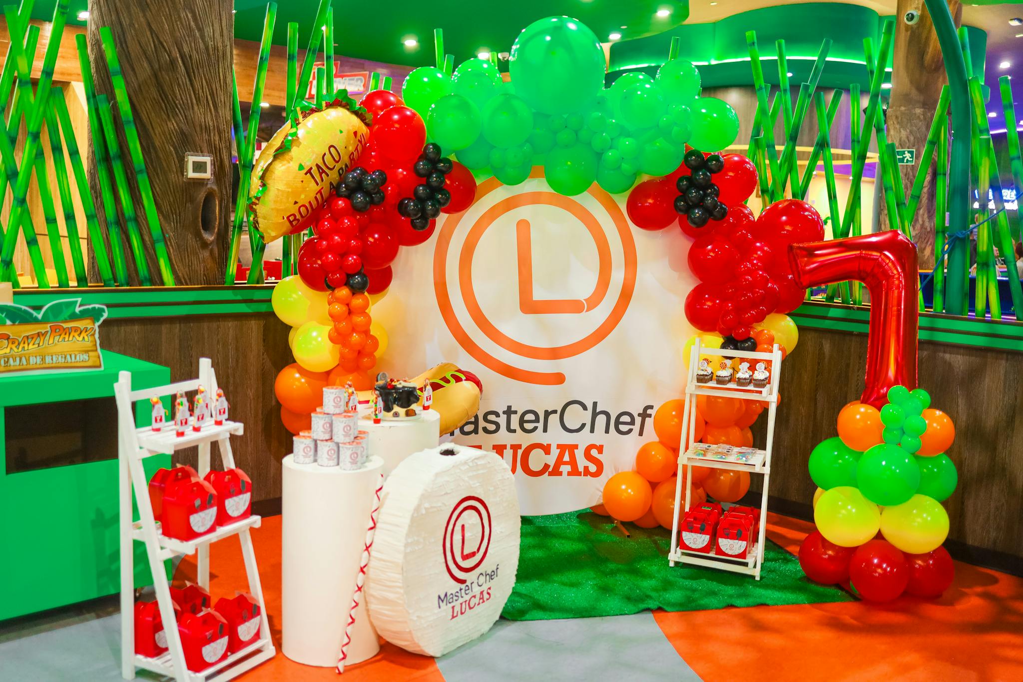 Vibrant balloon arch setup for a MasterChef themed celebration.